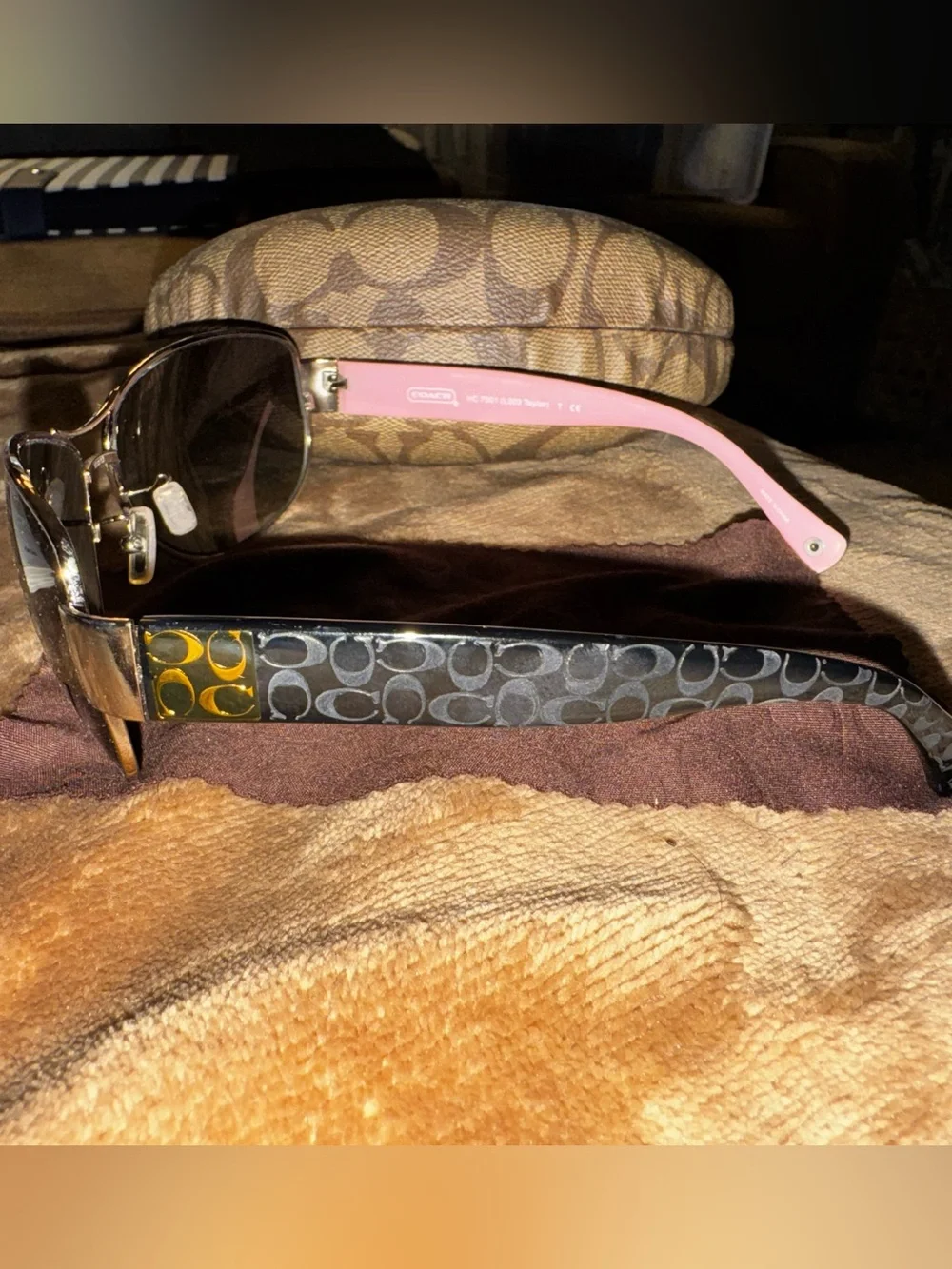 Coach aviator sunglasses with brown lenses and pink temples